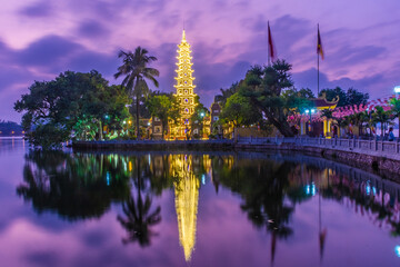 Fototapeta na wymiar HANOI, VIETNAM, 4 JANUARY 2020: Beautiful sunset over the Tran Quoc Pagoda of Hanoi