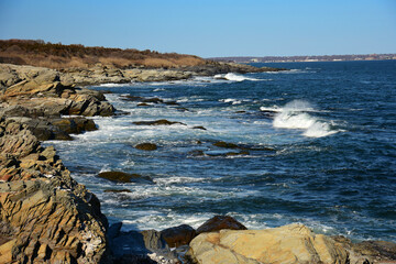rugged coastline and crashing surf of conanicut  island, rhode island