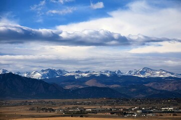 panoramic view from broomfield of the front range mountains of colorado, and dramatic 
cloud...