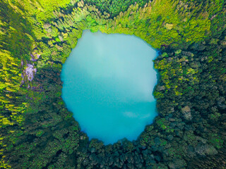 Aerial shot of congro lake with turquoise waters in Sao Miguel, Azores.