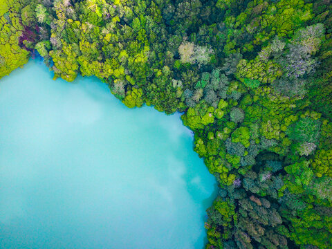 Aerial shot of congro lake with turquoise waters in Sao Miguel, Azores.
