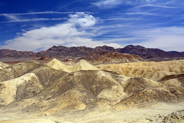 view of manly beacon from zabriskie point on a sunny day in death valley national park, california