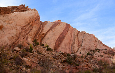 striking red striped  rock wall in uneva canyon in the san rafael swell near green river, utah