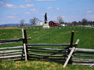 monument  to 73rd new york infantry,  split-rail fence,  and klingle farm at excelsior field in the...