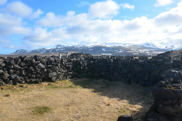 Lava Rock Animal Pen with Snow Covered Mountains