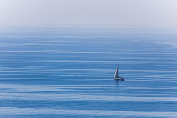 Sailing boat isolated. water textures and minimalistic view.