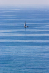 Sailing boat isolated. water textures and minimalistic view.