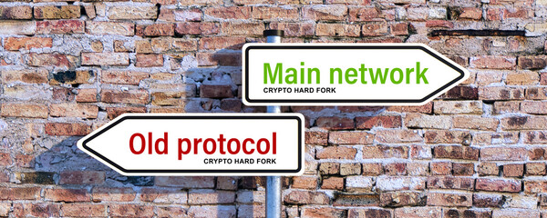 road signs pointing in two directions with the message CRYPTO HARD FORK, MAIN NETWORK and OLD...