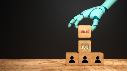 robot hand adding a cube with message VACCINE to a stack of cubes with person symbols in front of a blackboard background