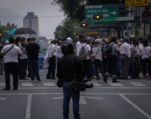 periodista fotógrafo en manifestación 
