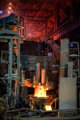 Electric steel furnace, glowing graphite electrodes