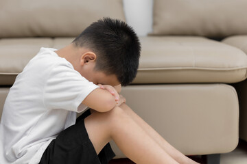 Asian child  sitting alone with sad feeling, Concept for depression stress or frustration
