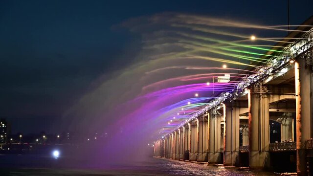 Rainbow fountain show during evening at Banpo Bridge in Seoul city,South Korea.