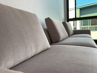 Close up detail of white fabric sofa.