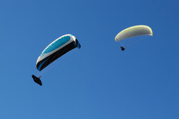 paragliding in the blue sky