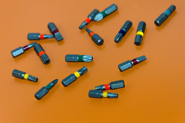 multi-colored bits from a screwdriver, tools for assembly, free space for insertion, selective focus