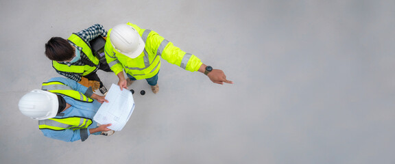 Banner : Civil engineer inspect structure at construction site against blueprint, Building inspector join inspect building structure with civil engineer. Civil engineer hold blueprint inspect building - obrazy, fototapety, plakaty