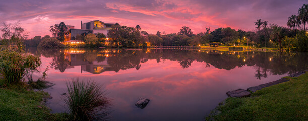 Fototapeta na wymiar Panoramic Lakeside Sunset with Cloud Reflections