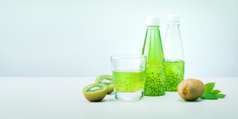 Green detox smoothie kiwi and mint on light green background with copy space. Banner.