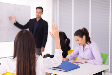 Audience woman raised hand and arm during meeting seminar,People sharing ideas and brainstorm,Asking and answer concept