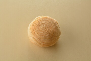 baked round crispy purple yam taro with sweet potato pumpkin sweet paste and egg yolk teochew mooncake on marble table lantern mid autumn festival chinese halal pastry product menu