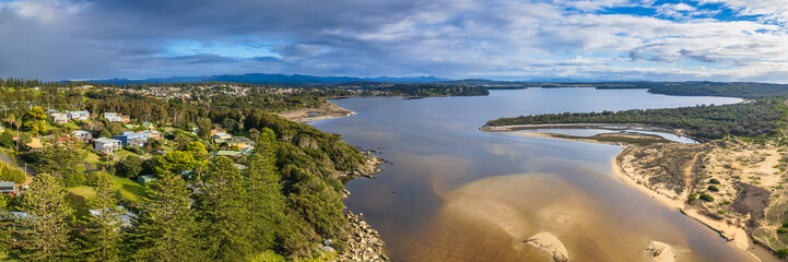 A cloud covered winters morning where the river meets the sea in Tuross Head