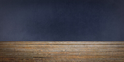 The background is blank wooden boards and a textured plastered wall with lighting and vignetting.