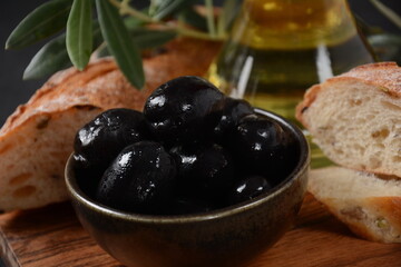 Olives, olive branch ,Olive oil on wooden background
