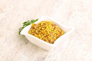 Grain mustard sauce in the bowl