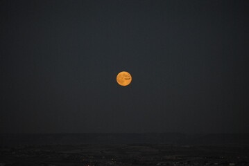 airplane crossing full moon