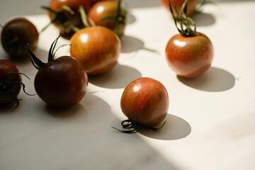 brown cherry tomatoes on the marble background