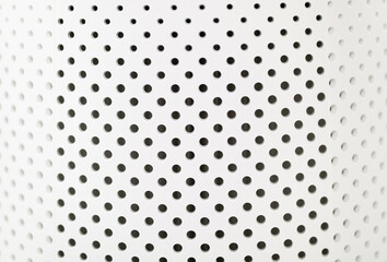 texture of white perforated plastic, close-up