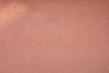 texture of facade plaster in orange color, fine structure