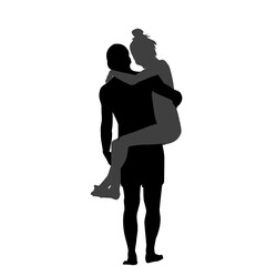 Silhouette of man carrying woman in his arms