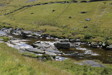 Fototapeta na wymiar The remote Ystwyth river in its valley in mid Wales.