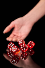 red and white craps or dices on reflective black background