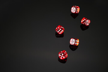 red and white craps or dices on reflective black background