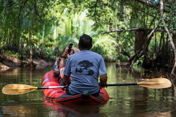 Tourist on canoe visit Little Amazon, Phang Nga