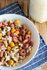 Colored cereals in a white bowl