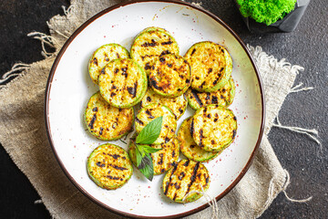 grilled zucchini fried vegetables on the table, healthy food meal snack copy space food background rustic. top view keto or paleo diet veggie vegan or vegetarian food