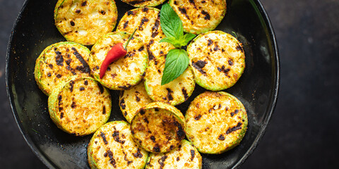 grilled zucchini fried vegetables on the table, healthy food meal snack copy space food background rustic. top view keto or paleo diet veggie vegan or vegetarian food