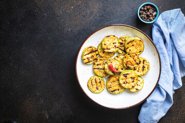 grilled zucchini fried vegetables on the table, healthy food meal snack copy space food background rustic. top view keto or paleo diet veggie vegan or vegetarian food