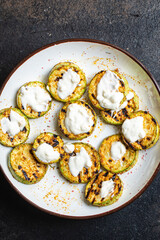 grilled zucchini fried vegetables on the table, healthy food meal snack copy space food background rustic. top view keto or paleo diet veggie vegan or vegetarian food