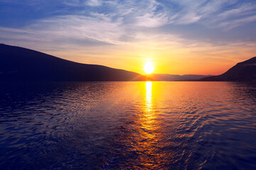 Spectacular twilight over the lagoon . Sunset reflection in the sea . Fantastic evening with mountains and sea 