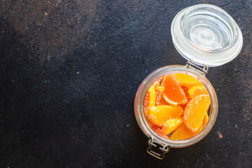 slices of marmalade jelly candy sweets candy citrus orange, tangerine, grapefruit, lemon on the table, healthy food meal snack copy space food background rustic. top view