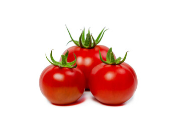 Three red fresh tomatoes on a white isolated background. Vegetarian food concept.