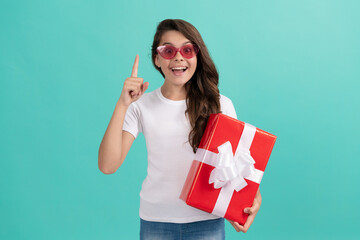 shopping final sell out. teenage shopper. stylish teen girl in sunglasses hold giftbox.