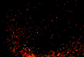 Sparks from fire on a black