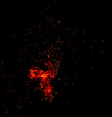 Sparks from fire on a black