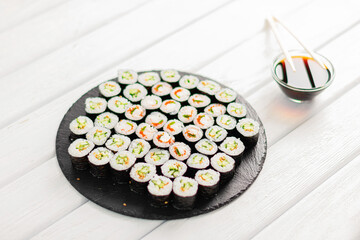 Sushi rolls on black board